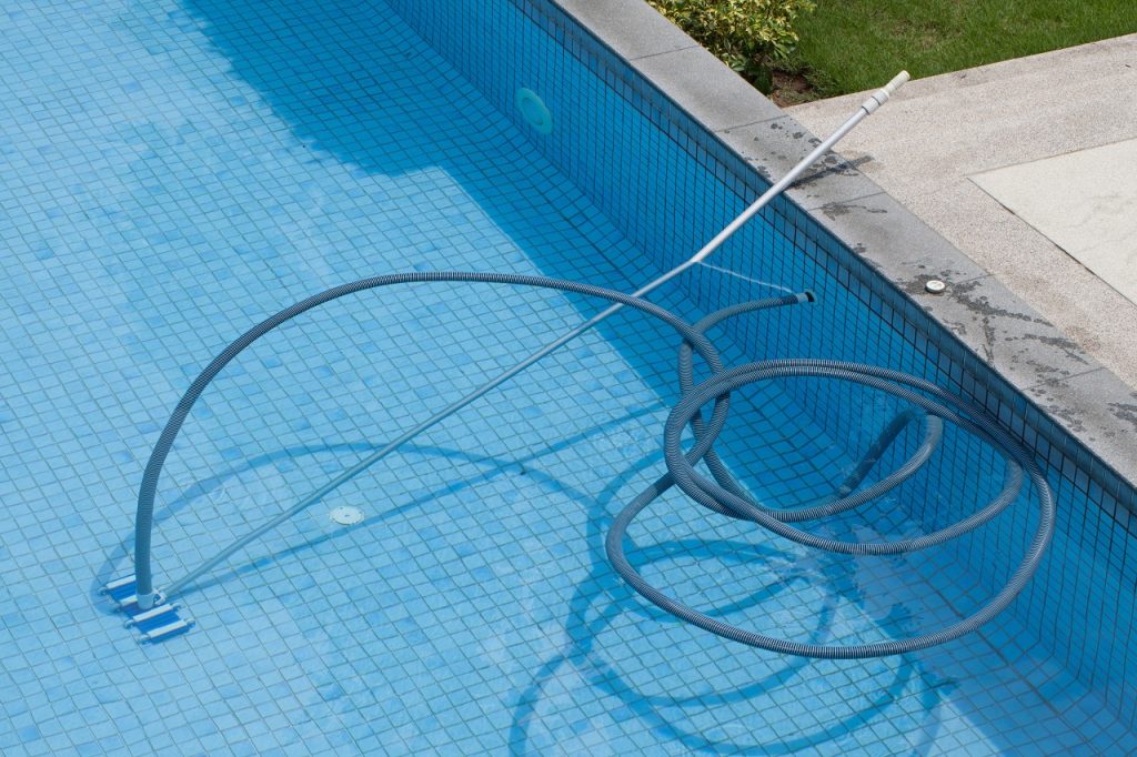 Pool with the underwater vacuum cleaner. sports concept